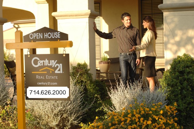 Real Estate Agent at an Open House