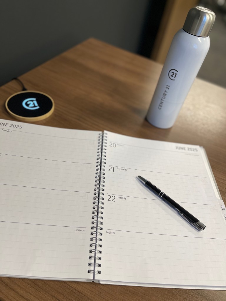 Calendar with pen and Century 21 water bottle