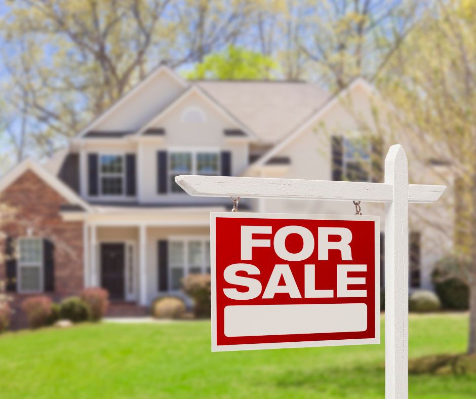 House with For Sale sign in front.